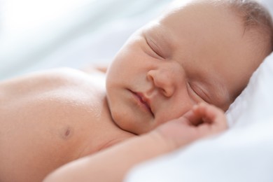 Photo of Cute newborn baby sleeping on bed indoors