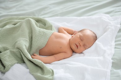 Photo of Cute newborn baby sleeping on bed indoors
