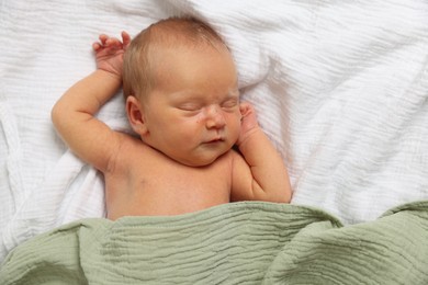 Photo of Cute newborn baby sleeping on bed, top view