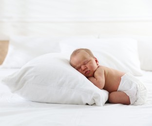 Photo of Cute newborn baby sleeping on bed indoors