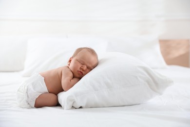 Photo of Cute newborn baby sleeping on bed indoors