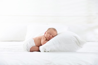 Photo of Cute newborn baby sleeping on bed indoors