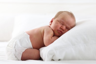 Photo of Cute newborn baby sleeping on bed indoors