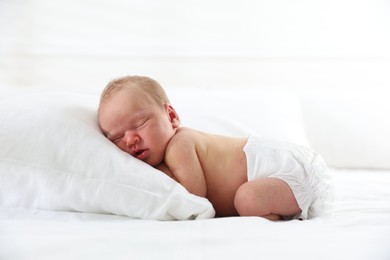 Photo of Cute newborn baby sleeping on bed indoors