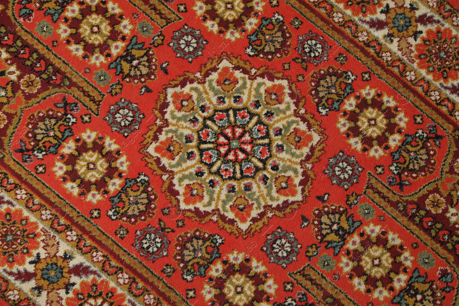 Soft red carpet with pattern as background, top view. Used stuff Photo of Soft red carpet with pattern as background, top view. Used stuff