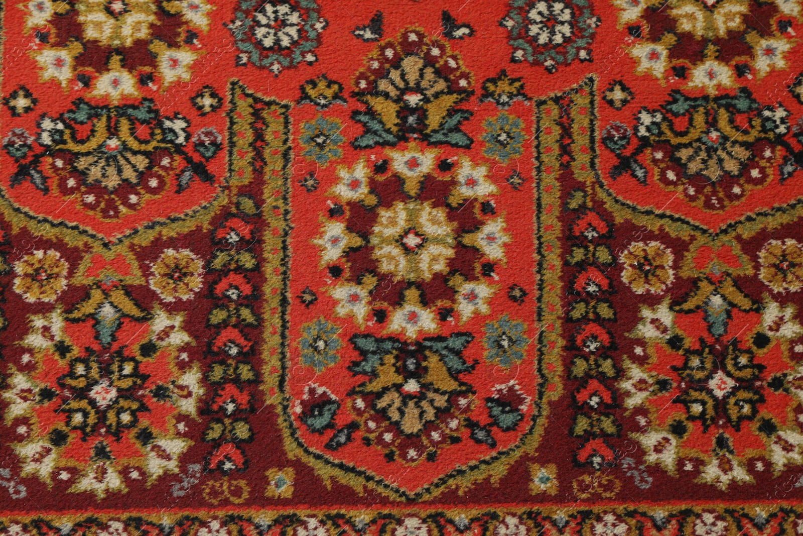 Soft red carpet with pattern as background, top view. Used stuff Photo of Soft red carpet with pattern as background, top view. Used stuff