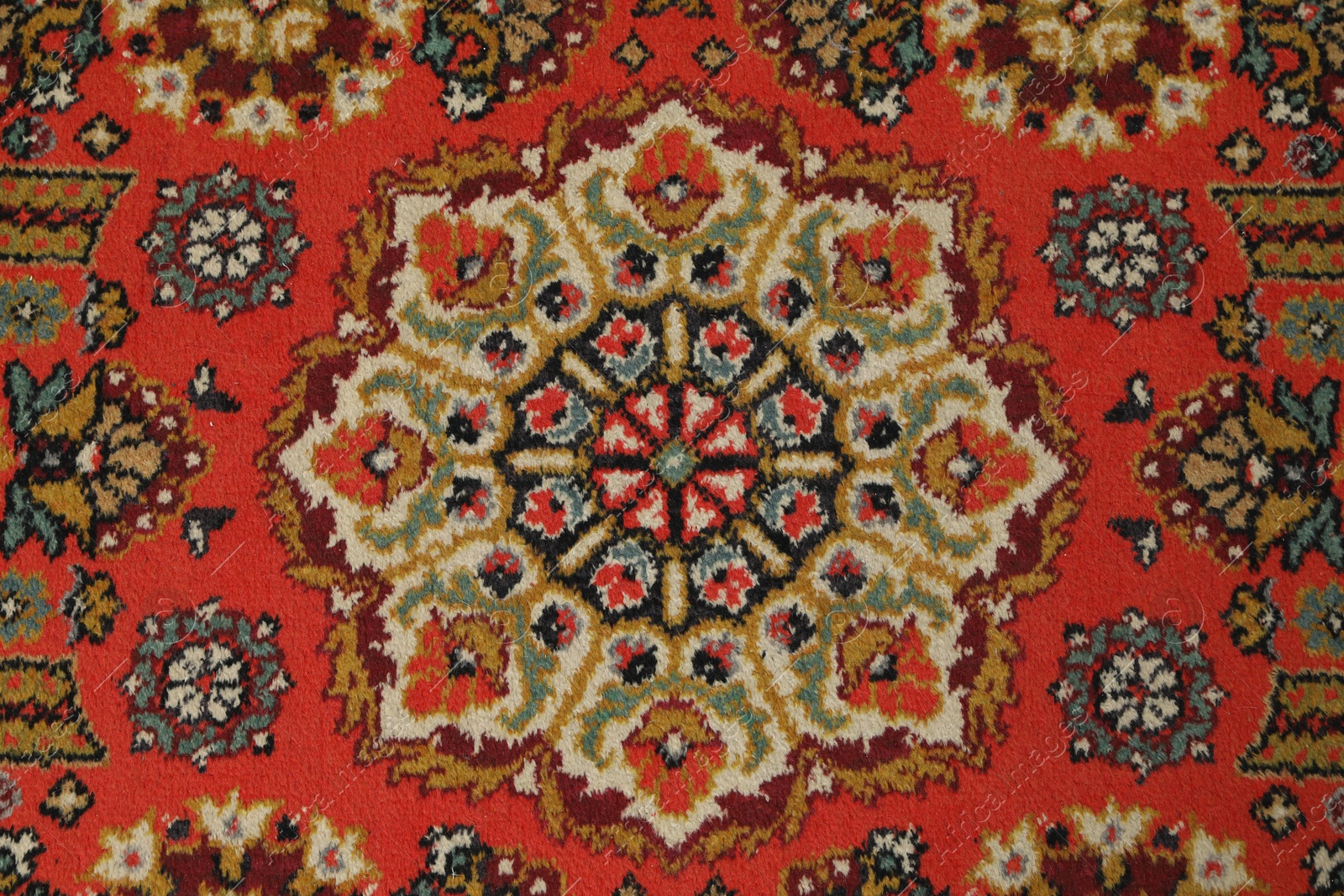 Soft red carpet with pattern as background, top view. Used stuff Photo of Soft red carpet with pattern as background, top view. Used stuff