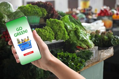 Image of Food delivery. Man using mobile phone app to order grocery online, closeup