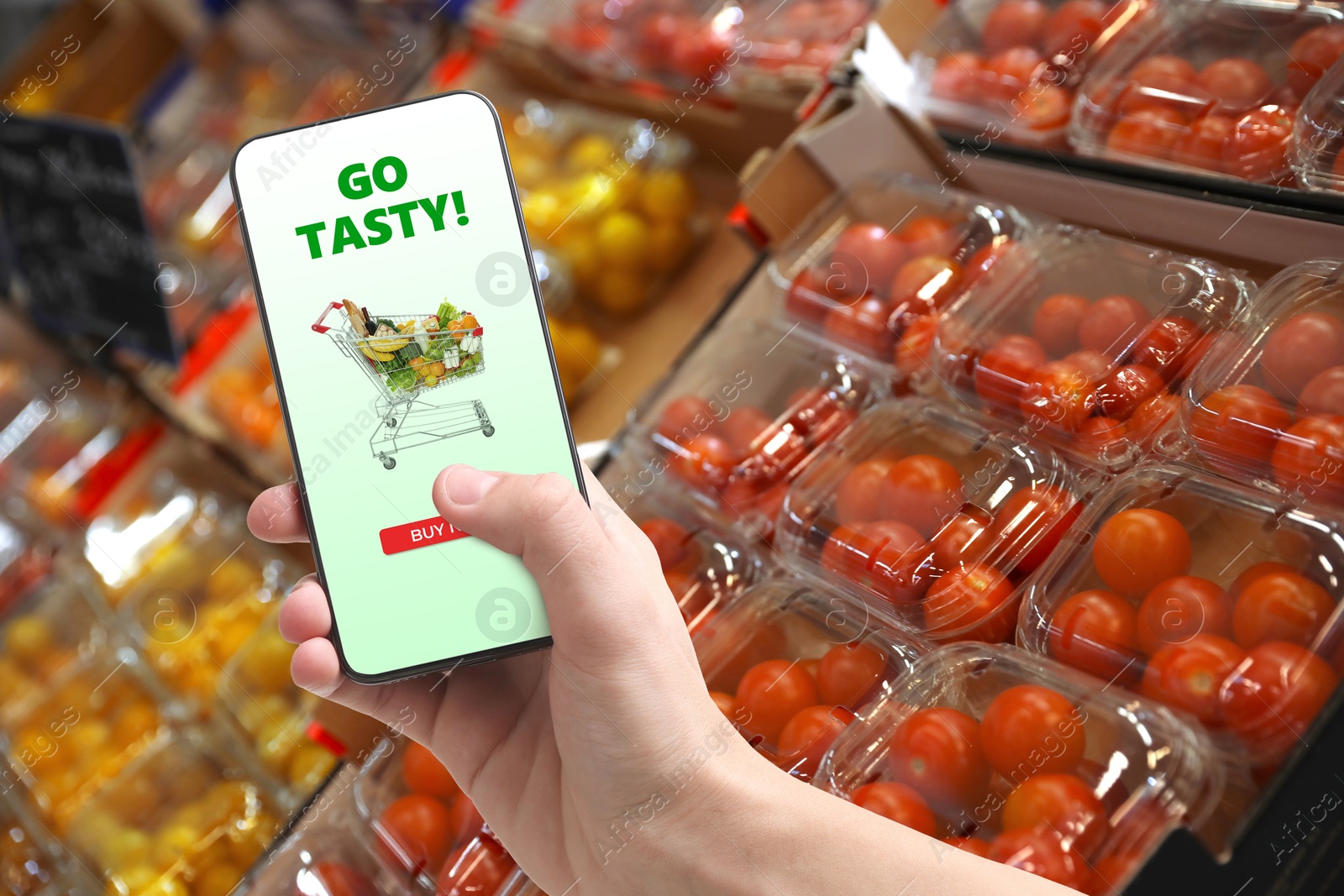 Food delivery. Man using mobile phone app to order grocery online, closeup Image of Food delivery. Man using mobile phone app to order grocery online, closeup