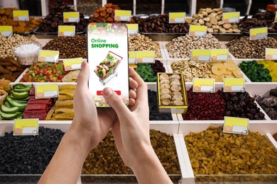Image of Food delivery. Man using mobile phone app to order grocery online, closeup