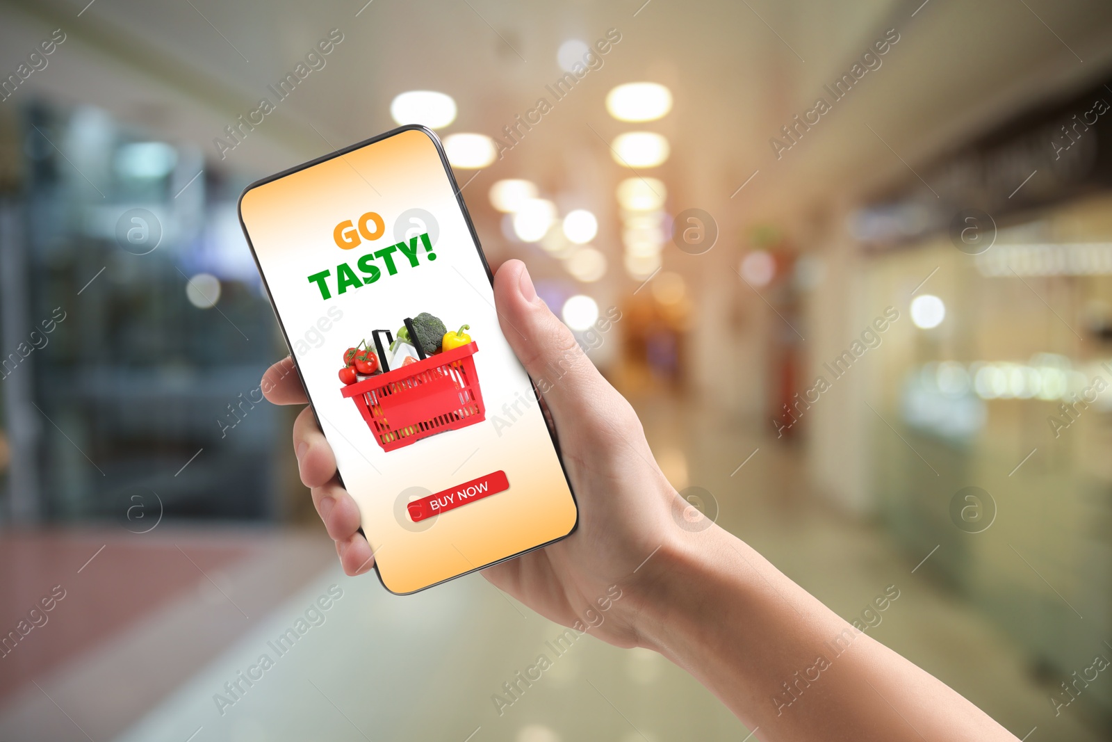 Food delivery. Man using mobile phone app to order grocery online, closeup Image of Food delivery. Man using mobile phone app to order grocery online, closeup