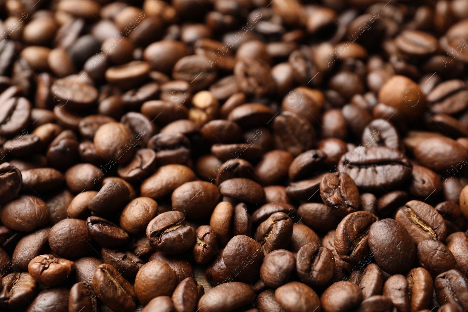 Aromatic coffee beans as background, closeup view Photo of Aromatic coffee beans as background, closeup view