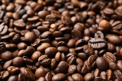 Photo of Aromatic coffee beans as background, closeup view