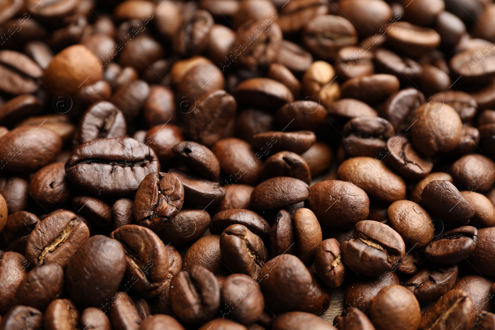 Aromatic coffee beans as background, closeup view Photo of Aromatic coffee beans as background, closeup view