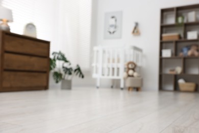 Photo of Blurred view of baby's room. Interior design