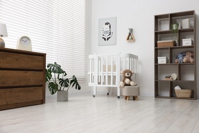 Photo of Baby's room with stylish furniture. Interior design