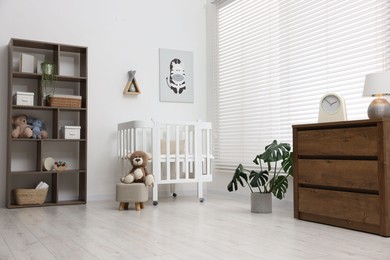 Photo of Baby's room with stylish furniture. Interior design