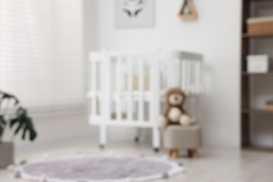 Photo of Blurred view of baby's room. Interior design