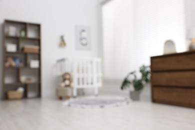 Photo of Blurred view of baby's room. Interior design
