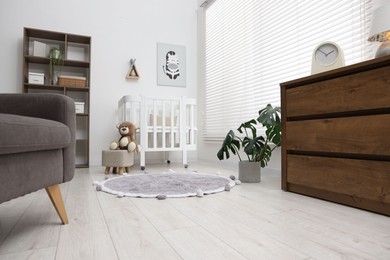 Photo of Baby's room with stylish furniture. Interior design