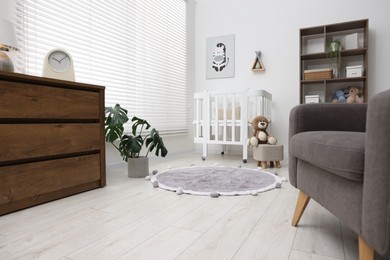 Photo of Baby's room with stylish furniture. Interior design