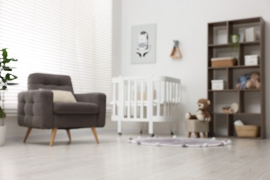 Photo of Blurred view of baby's room. Interior design