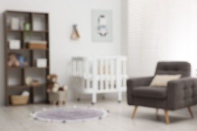 Photo of Blurred view of baby's room. Interior design