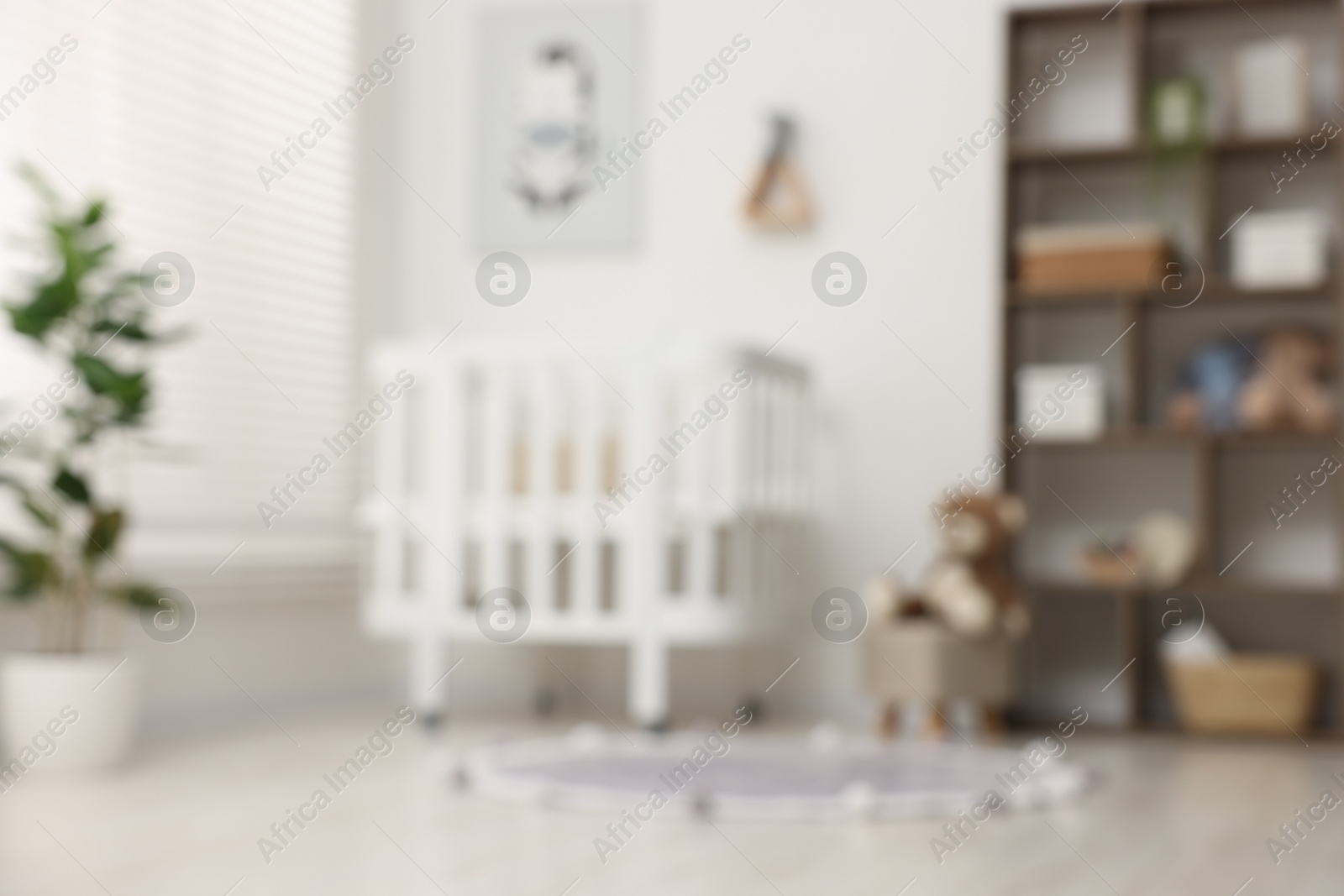 Photo of Blurred view of baby's room. Interior design