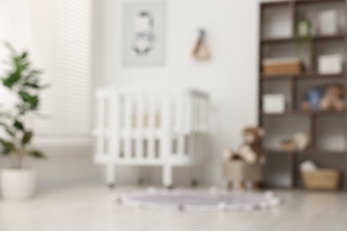 Photo of Blurred view of baby's room. Interior design