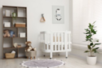 Photo of Blurred view of baby's room. Interior design
