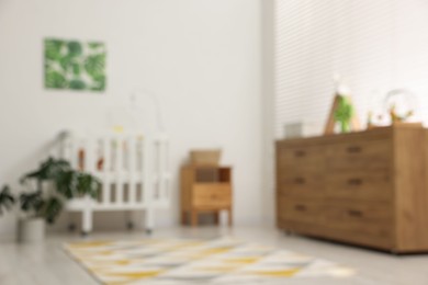 Photo of Blurred view of baby's room. Interior design