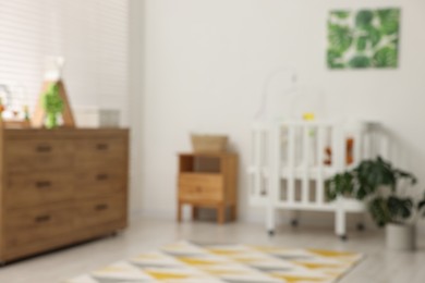 Photo of Blurred view of baby's room. Interior design