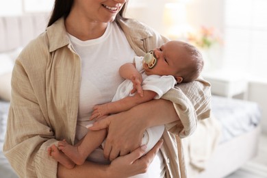 Photo of Mother with her newborn baby at home, closeup
