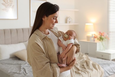 Photo of Mother with her newborn baby at home