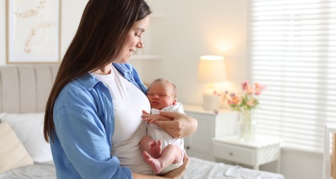 Photo of Mom with her newborn baby at home. Space for text
