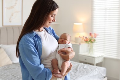 Photo of Mom with her newborn baby at home. Space for text