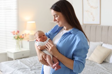 Photo of Mom with her newborn baby at home