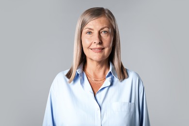 Photo of Portrait of beautiful senior woman on light background