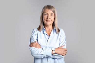 Photo of Portrait of beautiful senior woman on light background