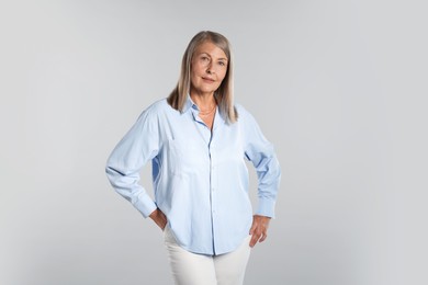 Photo of Portrait of beautiful senior woman on light background