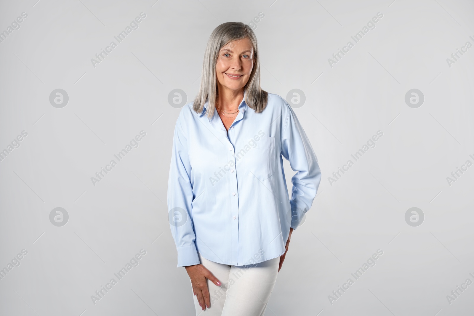 Photo of Portrait of beautiful senior woman on light background