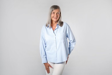 Photo of Portrait of beautiful senior woman on light background