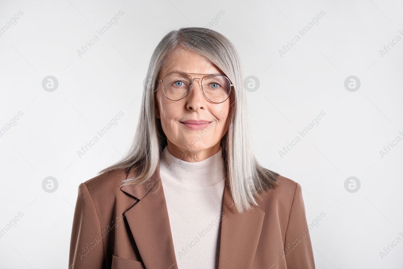 Photo of Portrait of beautiful senior woman on light background