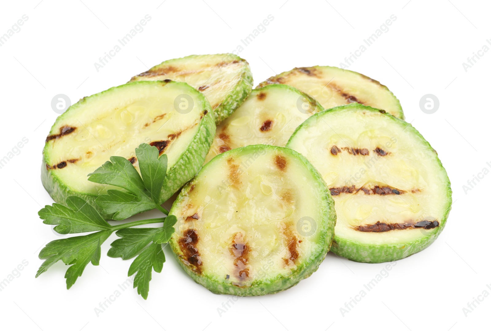 Delicious grilled courgette slices with parsley isolated on white Photo of Delicious grilled courgette slices with parsley isolated on white