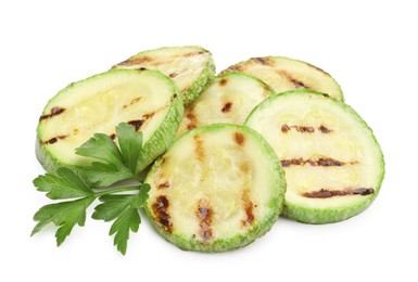 Photo of Delicious grilled courgette slices with parsley isolated on white