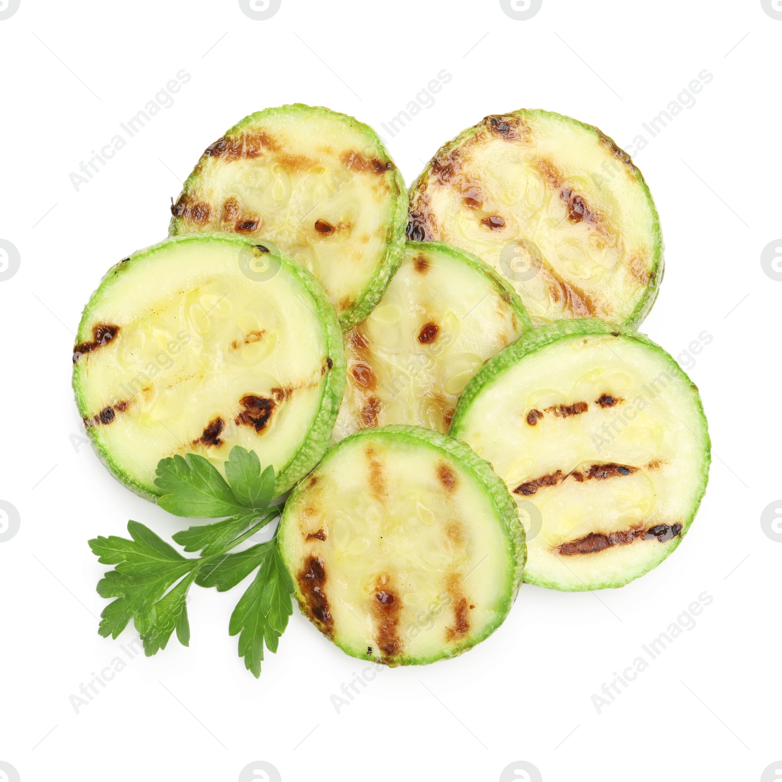 Delicious grilled courgette slices with parsley isolated on white, top view Photo of Delicious grilled courgette slices with parsley isolated on white, top view