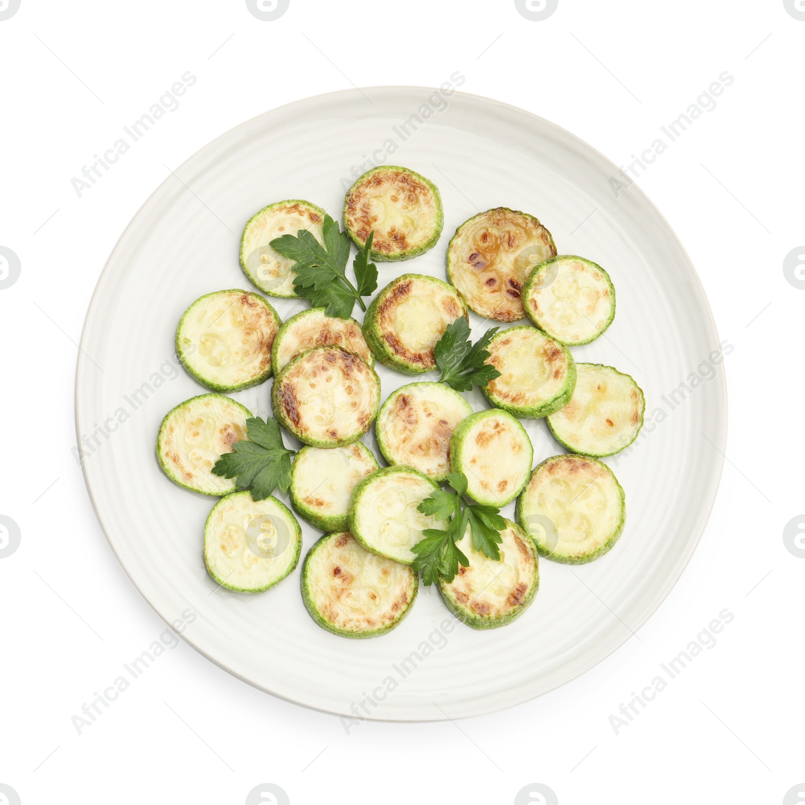 Delicious fried courgette slices with parsley isolated on white, top view Photo of Delicious fried courgette slices with parsley isolated on white, top view