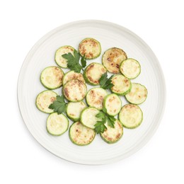 Photo of Delicious fried courgette slices with parsley isolated on white, top view