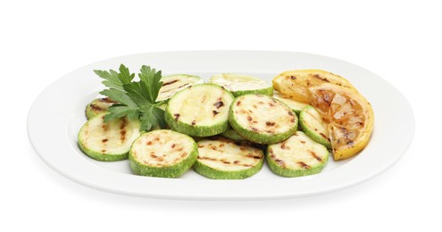 Photo of Delicious grilled courgette slices with lemon and parsley isolated on white