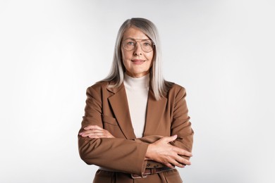Photo of Portrait of beautiful senior woman on light background